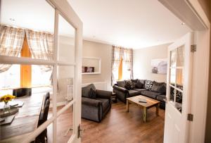 a living room with a couch and a table at The Townhouse in Fort William