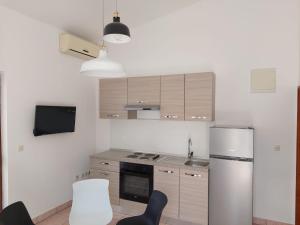 Kuchyň nebo kuchyňský kout v ubytování Apartmani Vesna