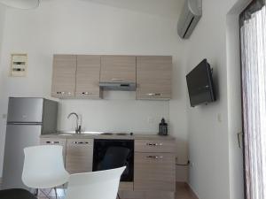 Kuchyň nebo kuchyňský kout v ubytování Apartmani Vesna