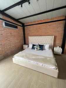 Кровать или кровати в номере Ramones Guest Houses