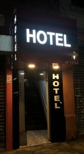 a hotel sign on the side of a building at Hotel Popular Vila Mariana in Sao Paulo