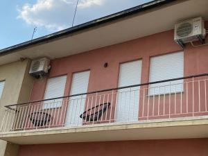 a balcony of a building with two air conditioners at Barros' House in Chaves