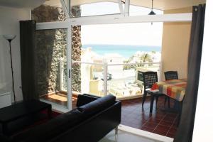 a living room with a view of the ocean at *Traum am Strand * Casa Lea * Costa Calma * in Costa Calma