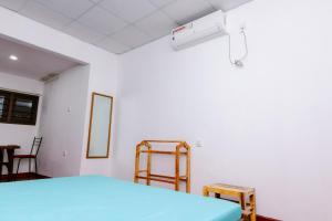 Postel nebo postele na pokoji v ubytování Savenndra Hotel