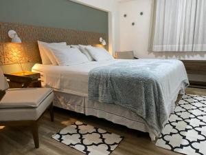Cama o camas de una habitación en Ap lindo, moderno, confortável, novo!