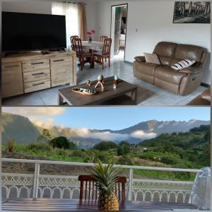 ein Wohnzimmer mit einem TV und ein Wohnzimmer mit Bergblick in der Unterkunft Maison Créole Soalaze in Salazie