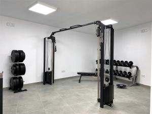 a room with a gym with a rack of weights at Balcon del Mar Seaview 114 Casasol in Nerja