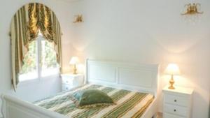 Letto o letti in una camera di Villa Millésime