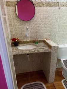 a bathroom with a sink and a toilet at Pousada Linda Vista in Domingos Martins