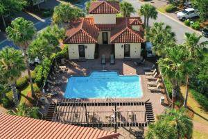 an aerial view of a house with a swimming pool at Large 4 bedroom with bunk room and 2 golf carts! in Destin
