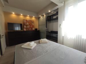 Posteľ alebo postele v izbe v ubytovaní Appartamento incantevole con parcheggio gratuito