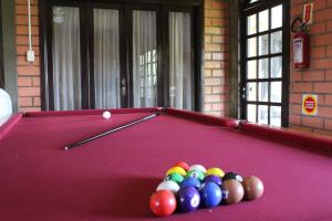 a pool table with a group of balls on it at Hotel Colina Verde in Concordia