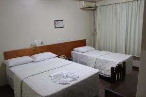 Ένα ή περισσότερα κρεβάτια σε δωμάτιο στο Hotel Colina Verde +47 φωτογραφίες