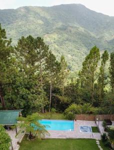 Bazén v ubytování Hermosa Villa Campestre en san cristobal a 45 minutos de la ciudad con piscina y BBQ nebo v jeho okolí