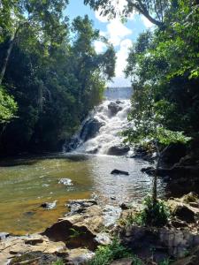 a waterfall in the middle of a river at Sitio Namaste in Itacaré