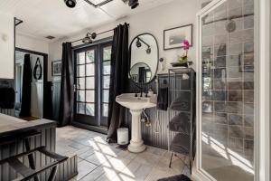 a bathroom with a sink and a shower at 100 Mile View-Fire Pit, Romantic, Peaceful, Private in Crestline