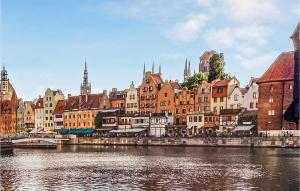 a view of a city with a river and buildings at 1 Bedroom Stunning Apartment In Gdansk in Gdańsk