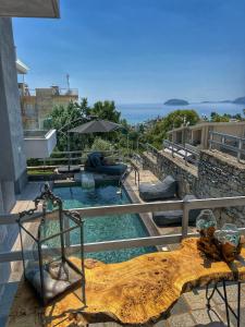 a house with a swimming pool with a view of the ocean at Villa Thalia in Kavala