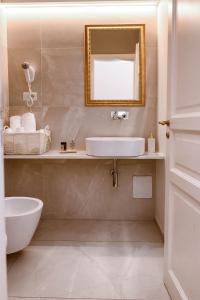 a bathroom with a sink and a mirror at B&B Palazzo Cerami in Catania