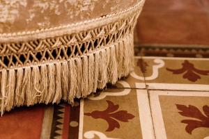 a rug sitting on top of a tiled floor at B&B Palazzo Cerami in Catania