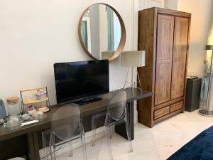 TV a/nebo společenská místnost v ubytování Casa del corso