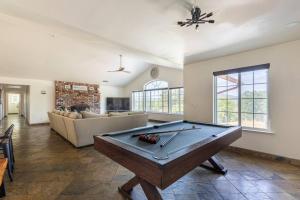 a living room with a pool table in it at Villa near Yosemite & bass lake w/Hot Tub/EVcharge in Oakhurst