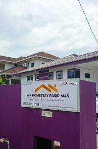 a sign for a wuhan pharmacyacistacistacistacistacistaciststrationstration at WK HOMESTAY PASIR MAS in Pasir Mas