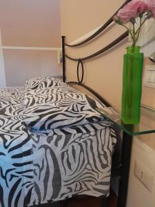 Postel nebo postele na pokoji v ubytování B&B Quattro Lune