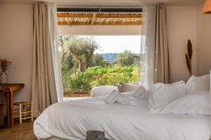 Кровать или кровати в номере VILLA FLAKA Boutique Hôtel Confidentiel et Convivial