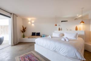 Кровать или кровати в номере VILLA FLAKA Boutique Hôtel Confidentiel et Convivial