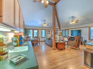 a large kitchen and living room with wooden floors at Riverbend Retreat Fla in Riverview