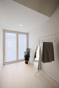 Ein Bett oder Betten in einem Zimmer der Unterkunft SCHICK und LUFTIG im Herzen von Linz