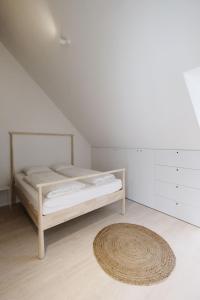 Ein Bett oder Betten in einem Zimmer der Unterkunft SCHICK und LUFTIG im Herzen von Linz
