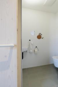 a bathroom with a toilet and a sink at SCHICK und LUFTIG im Herzen von Linz in Linz