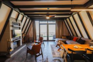 a living room with a couch and a table at World DREAMS Forest in Sapanca