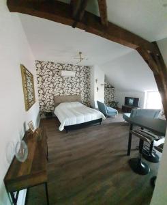 a bedroom with a white bed and a piano at Centre de Provins : superbe appartement neuf in Provins