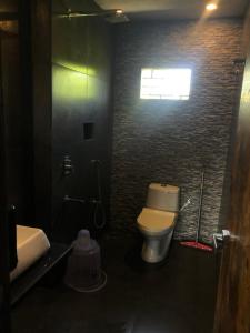 A bathroom at Aariv Inn BAGA BEACH