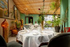a table in a restaurant with a white table cloth at La Varangue in Antananarivo