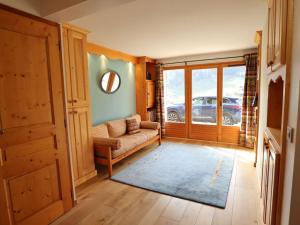 a living room with a couch and a window at Chalet Arêches-Beaufort, 9 pièces, 10 personnes - FR-1-342-232 in Beaufort