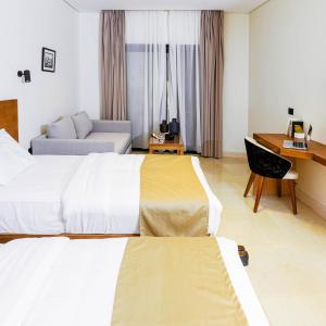 Postel nebo postele na pokoji v ubytování NewCity Hotel & Suites