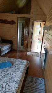 Postel nebo postele na pokoji v ubytování Садиба під Чертежиком 2