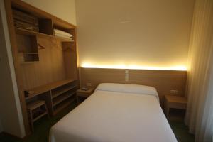 Posteľ alebo postele v izbe v ubytovaní Hotel Cal Piteu