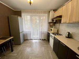 Η κουζίνα ή μικρή κουζίνα στο Квартира