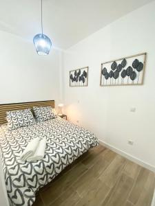 Postel nebo postele na pokoji v ubytování China Town Madrid 01