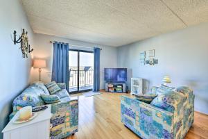 a living room with a couch and a tv at Beachfront North Wildwood Condo with Ocean Views! in North Wildwood