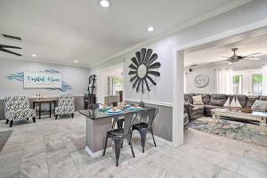 a kitchen and living room with a table and chairs at Crystal River Getaway with Hot Tub and Game Room! in Crystal River