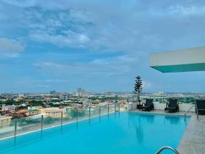 a large swimming pool on the roof of a building at Mabolo Garden Flats 2306 in Cebu City
