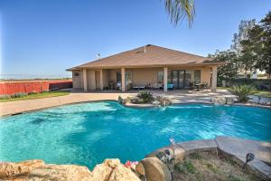 a swimming pool in front of a house at Near Wineries Elk Grove Getaway with Saltwater Pool in Elk Grove