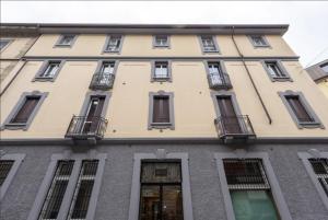 a large building with windows and balconies at Future Apartments in Milan