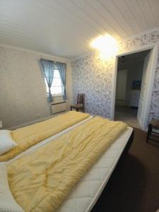 Postel nebo postele na pokoji v ubytování Cloudberry Lodge